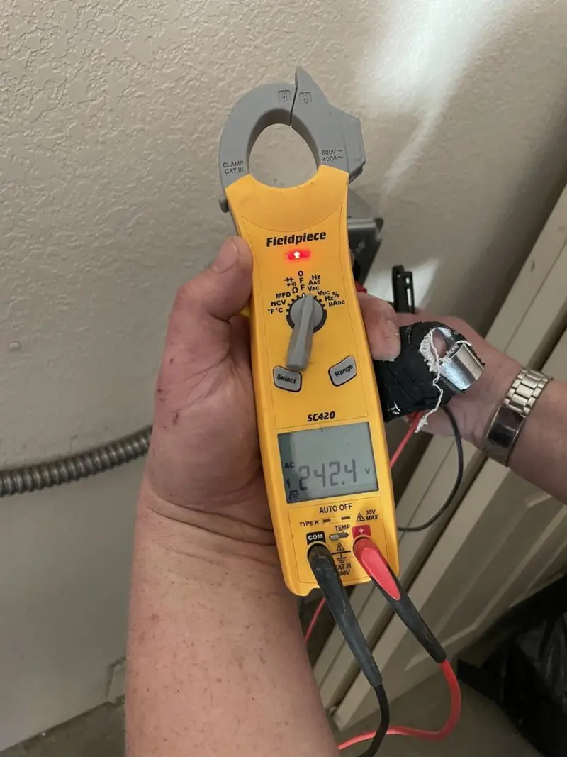 Voltage testing with clamp meter during Circuit Breaker Repair in Denton